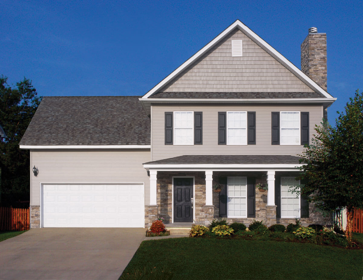 A beautiful two-story single-family home in Phoenixville, PA with a newly installed asphalt shingle roof by ELR Roofing.