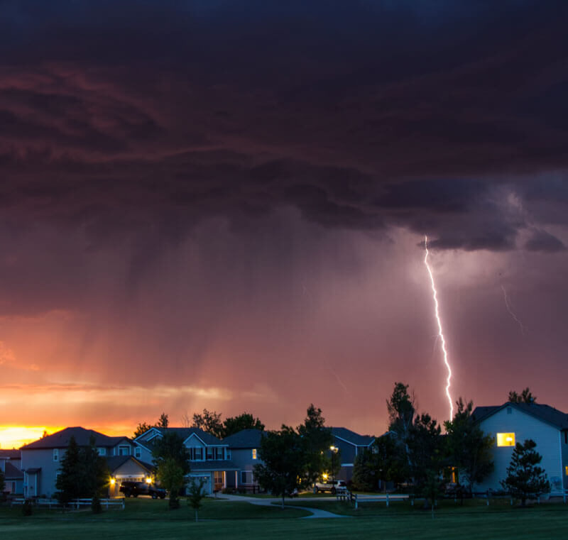 Severe thunderstorm and lightning strike over residential neighborhood homes in Montgomery County, PA